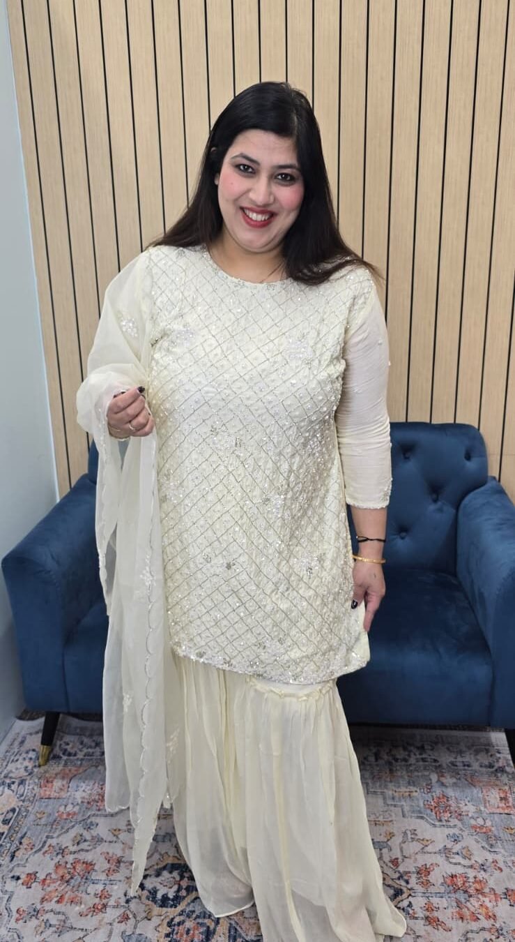 Exude effortless elegance in this dreamy cream sharara set