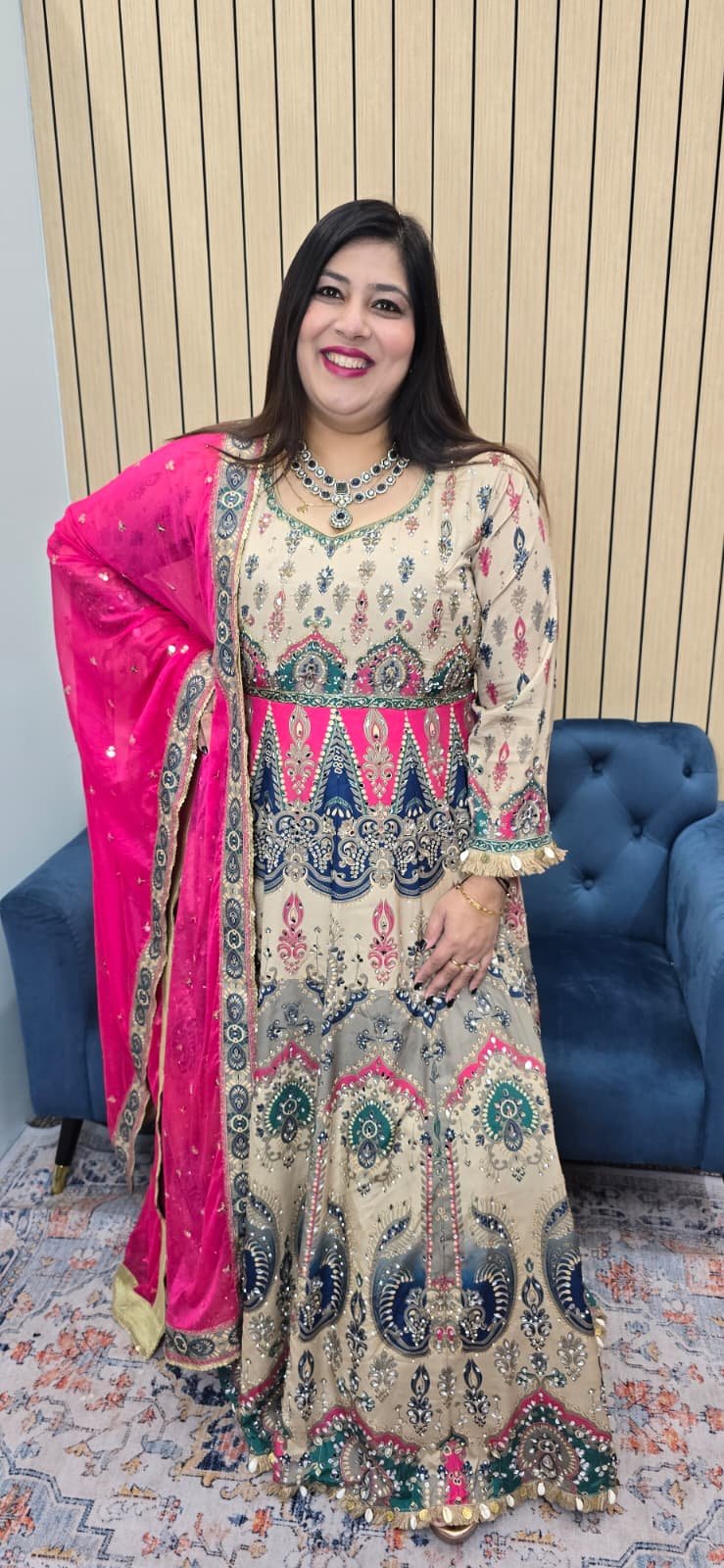 Elegant cream Anarkali gown with multicolored ethnic prints